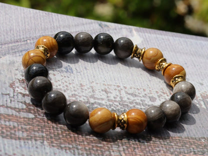 Engaging natural wood lace with Rainbow Obsidian combined Diabolo / Rondel. calming fears and insecurities and strengthening one’s courage.