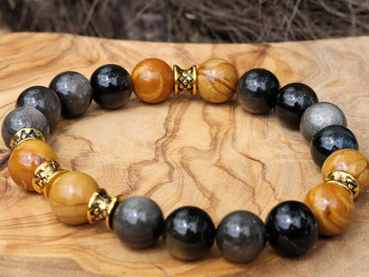 Engaging natural wood lace with Rainbow Obsidian combined Diabolo / Rondel. calming fears and insecurities and strengthening one’s courage.