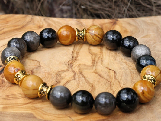 Engaging natural wood lace with Rainbow Obsidian combined Diabolo / Rondel. calming fears and insecurities and strengthening one’s courage.