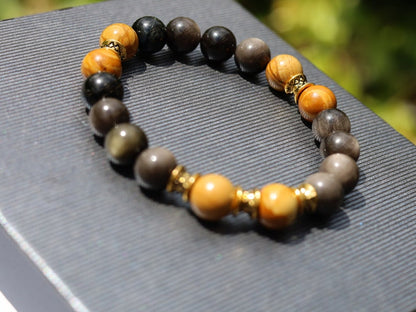 Engaging natural wood lace with Rainbow Obsidian combined Diabolo / Rondel. calming fears and insecurities and strengthening one’s courage.