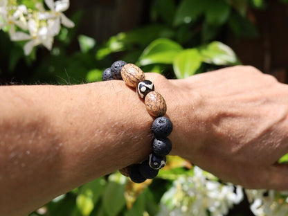 Fervid 12 mm Lava bracelet with beautiful Undyed & Natural Bodhi Beads. Combined with Om Mani Padme Hum beads. The jewel is in the lotus