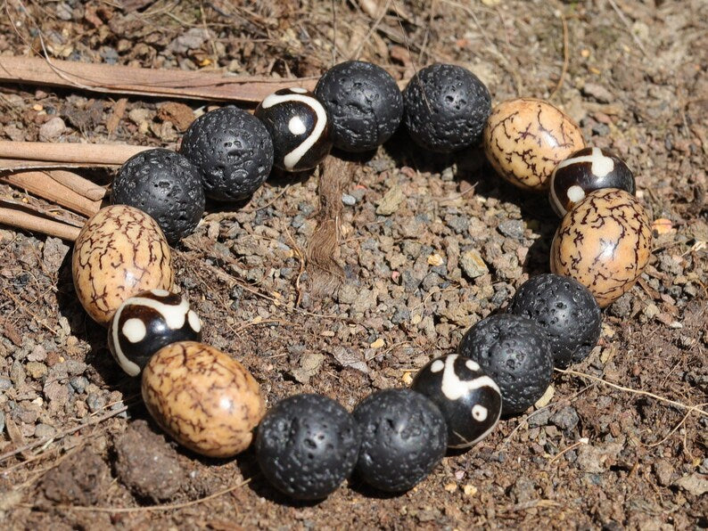 Fervid 12 mm Lava bracelet with beautiful Undyed & Natural Bodhi Beads. Combined with Om Mani Padme Hum beads. The jewel is in the lotus