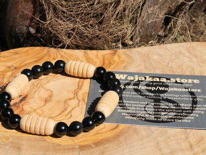 Easy going Natural Obsidian Grade AA, with Turned wooden beads. Symbolically, wood has a strong connection with the Earth and nature.