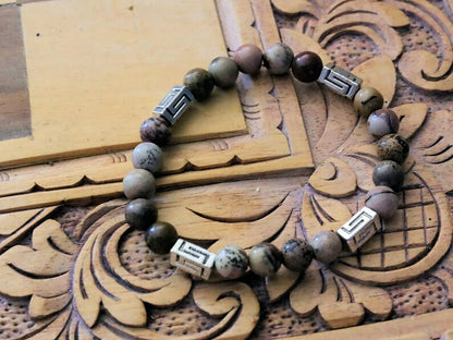 Visible Rhodonite Beaded bracelet with Antique Silver Tone Spacer Beads Pentagon. your emotions to the point of clarity and refinement