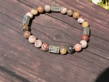 Visible Rhodonite Beaded bracelet with Antique Silver Tone Spacer Beads Pentagon. your emotions to the point of clarity and refinement