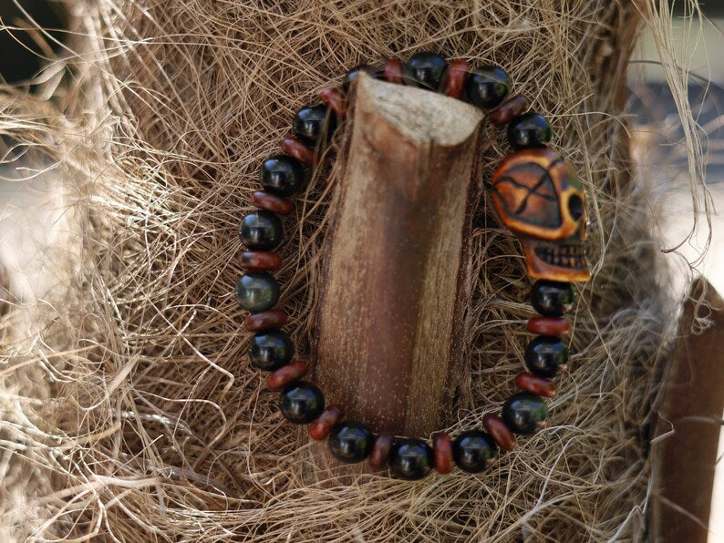 Disturbing  Obsidian Grade AA, with  wooden spacer beads. Symbolically, wood has a strong connection with the Earth and nature.