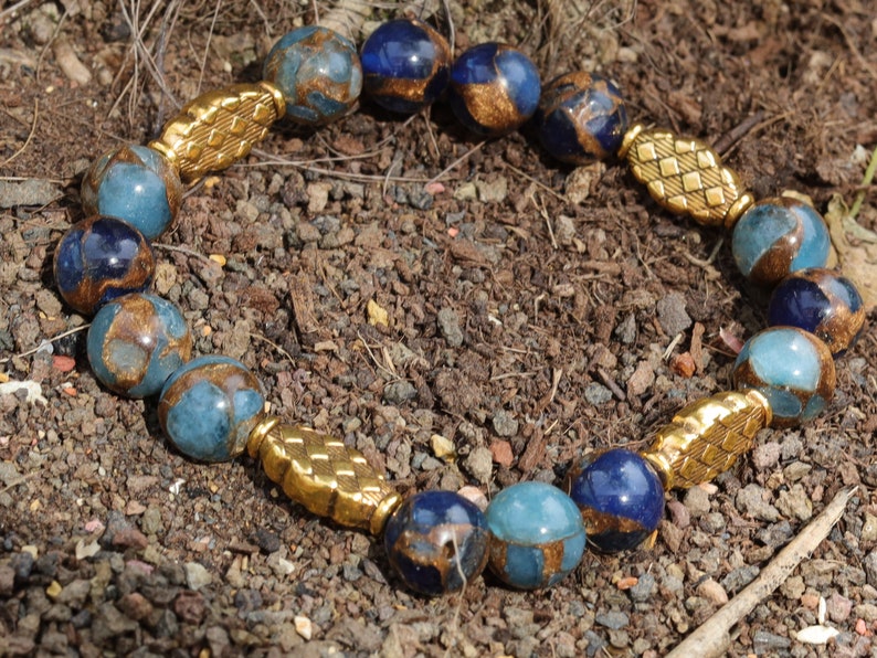 Great 10 mm Aqua Aura Quartz bracelet and 4 Tibetan Style Alloy Beads. The mind and body and to bring a sense of tranquility and balance