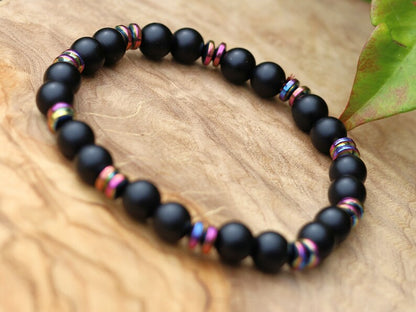 Curious matte Agate combined with Grade A Non-magnetic Hematite Rondelle Multi-color Plated.  Strung on durable stretchy cord