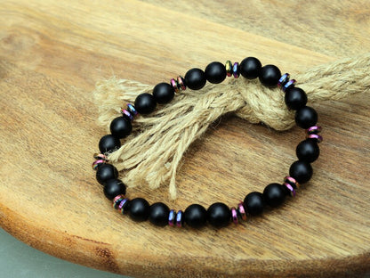 Curious matte Agate combined with Grade A Non-magnetic Hematite Rondelle Multi-color Plated.  Strung on durable stretchy cord
