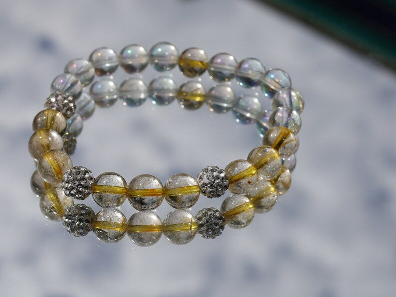 Gahiṇā Jewel Collection - Unique Bracelet with Angel Aura with Top quality Rutilated quartz beads. Extra 3x Pave Disco Ball Beads