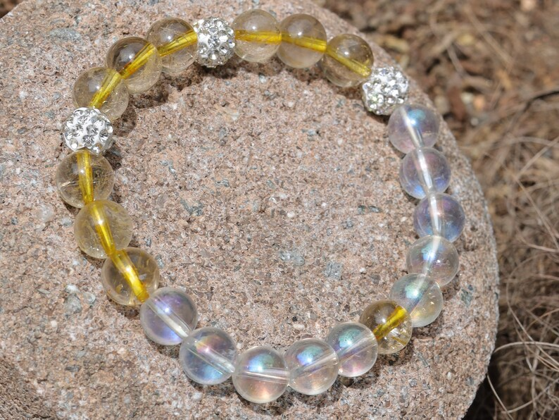 Gahiṇā Jewel Collection - Unique Bracelet with Angel Aura with Top quality Rutilated quartz beads. Extra 3x Pave Disco Ball Beads