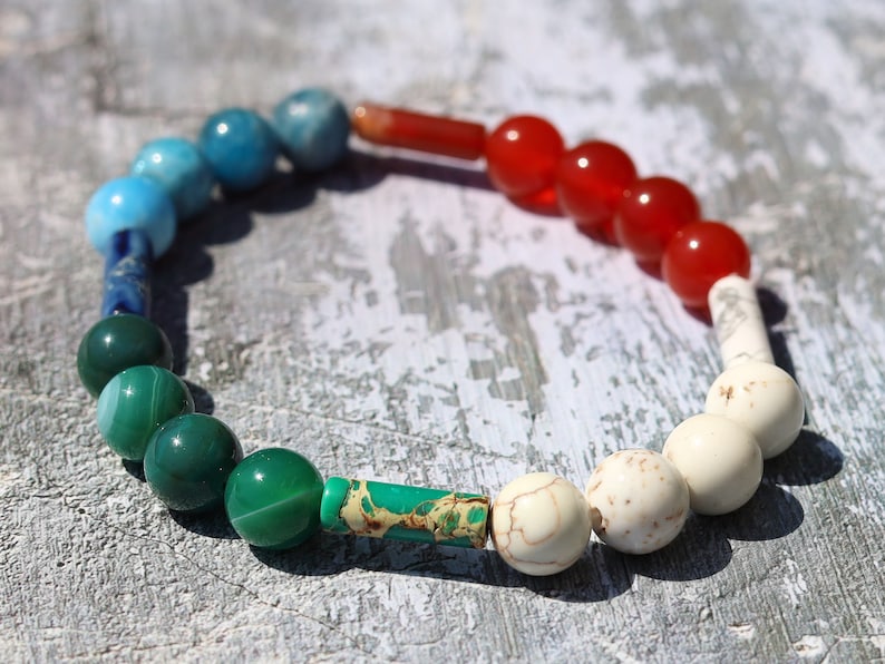 8 gemstones bracelet. Magnesite, Carnelian, Red Sea Sediment Jasper, Apatite. Jasper Cerise, Red Netstone, Dark Turquoise, Jasper Slate Blue