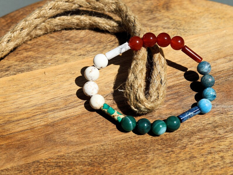 8 gemstones bracelet. Magnesite, Carnelian, Red Sea Sediment Jasper, Apatite. Jasper Cerise, Red Netstone, Dark Turquoise, Jasper Slate Blue