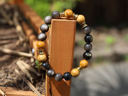 Engaging natural wood lace with Rainbow Obsidian combined Diabolo / Rondel. calming fears and insecurities and strengthening one’s courage.