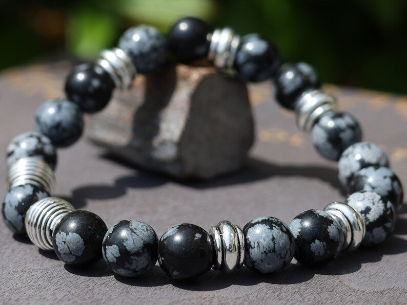 Astonishing 11 mm Snowflake Obsidian bracelet with Antique Silver, Rondelle. It can bring about a balance to body, mind and spirit