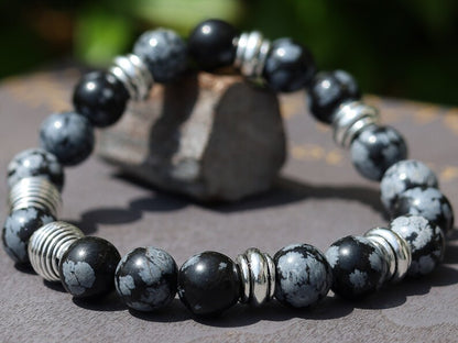 Astonishing 11 mm Snowflake Obsidian bracelet with Antique Silver, Rondelle. It can bring about a balance to body, mind and spirit