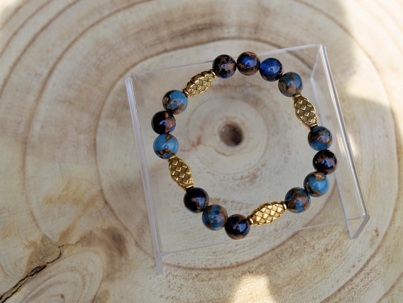 Great 10 mm Aqua Aura Quartz bracelet and 4 Tibetan Style Alloy Beads. The mind and body and to bring a sense of tranquility and balance