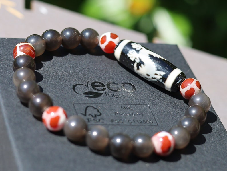 LIMITED EDITION Authentic Dragon Dzi Bead Agate . This precious bead is strung with new Natural Ice Obsidian Beads. Unique, handmade jewelry