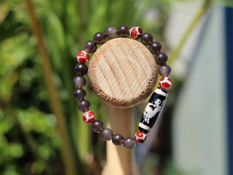 LIMITED EDITION Authentic Dragon Dzi Bead Agate . This precious bead is strung with new Natural Ice Obsidian Beads. Unique, handmade jewelry