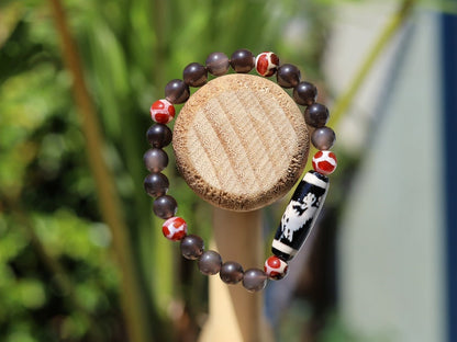 LIMITED EDITION Authentic Dragon Dzi Bead Agate . This precious bead is strung with new Natural Ice Obsidian Beads. Unique, handmade jewelry