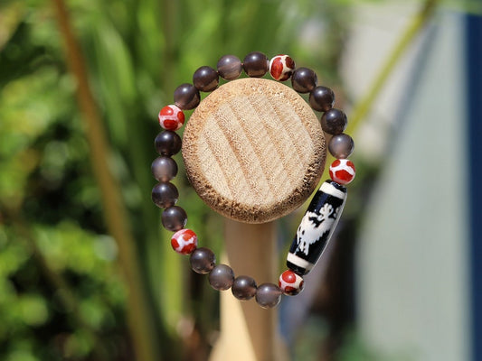 LIMITED EDITION Authentic Dragon Dzi Bead Agate . This precious bead is strung with new Natural Ice Obsidian Beads. Unique, handmade jewelry
