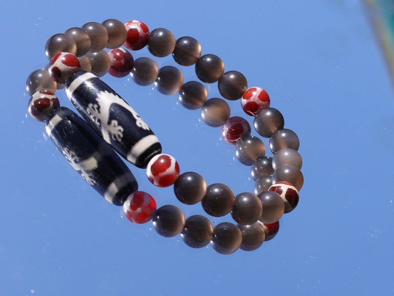 LIMITED EDITION Authentic Dragon Dzi Bead Agate . This precious bead is strung with new Natural Ice Obsidian Beads. Unique, handmade jewelry