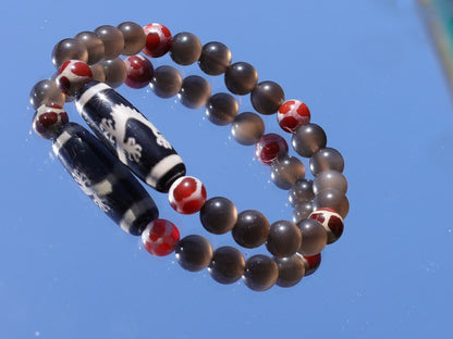 LIMITED EDITION Authentic Dragon Dzi Bead Agate . This precious bead is strung with new Natural Ice Obsidian Beads. Unique, handmade jewelry