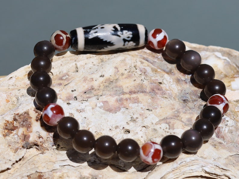 LIMITED EDITION Authentic Dragon Dzi Bead Agate . This precious bead is strung with new Natural Ice Obsidian Beads. Unique, handmade jewelry