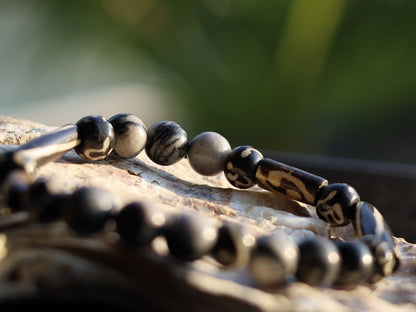 Black Silk Stone/Netstone Beads  bracelet with handmade Oxbone Tibetan prayerbeads. Haḍīāṁ Jewel