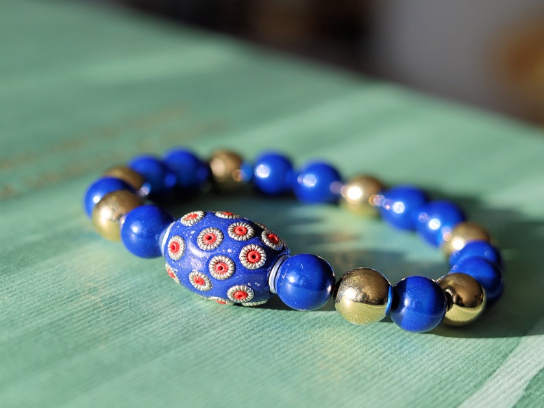 Handmade Indonesia Beads with 3D Miracle beads and a  mirrored top layer. ook into the bead, it looks like there is still a bead in it.