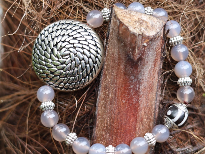 Quality AAA Gray Agates Natural Stone bracelet with a Unique Silver color metal look coin and Tibetan Style dZi Bead.