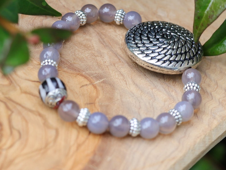 Quality AAA Gray Agates Natural Stone bracelet with a Unique Silver color metal look coin and Tibetan Style dZi Bead.