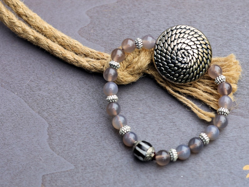 Quality AAA Gray Agates Natural Stone bracelet with a Unique Silver color metal look coin and Tibetan Style dZi Bead.