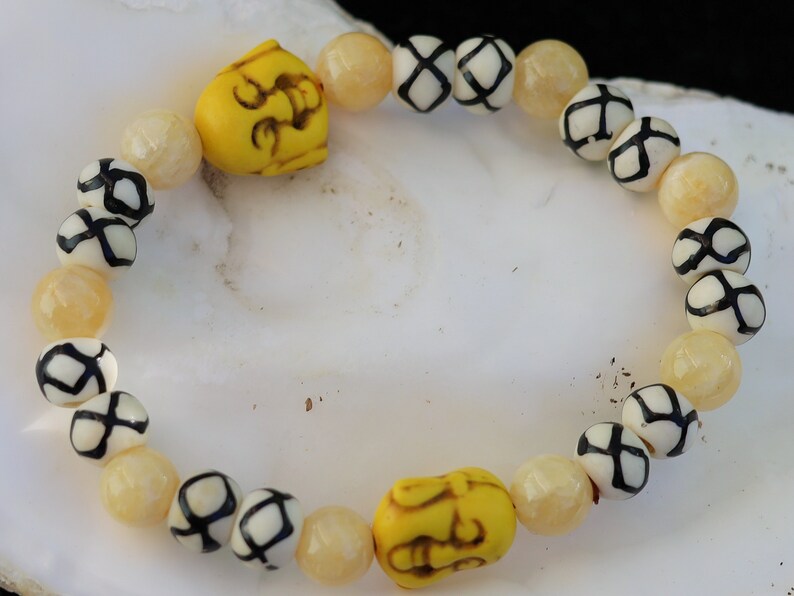 Topaz Jade Beads bracelet with Howlite bead Buddha yellow. absorb, and clear the constant stream of chatter from the mind. Haḍīāṁ