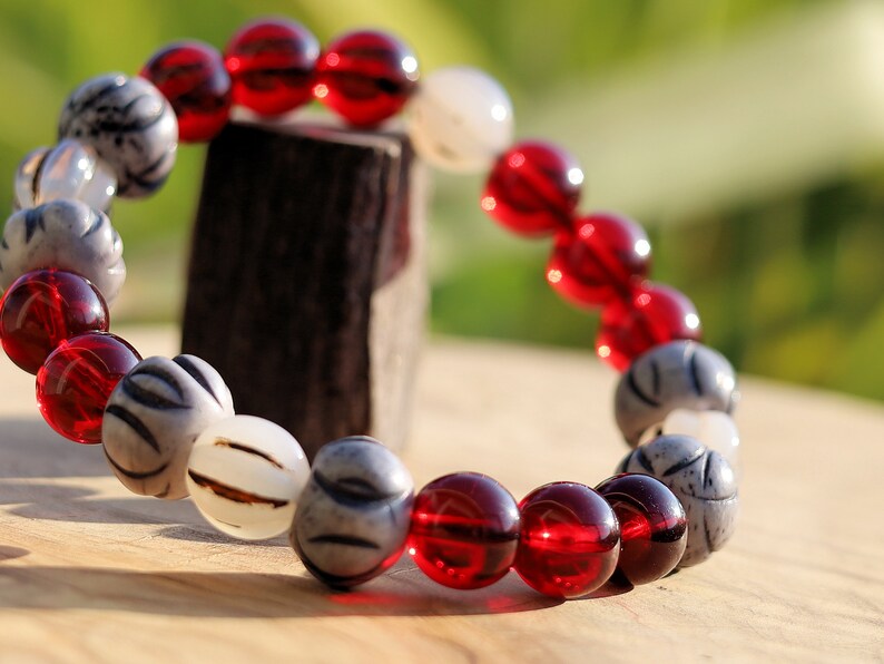 Unique Mexico red blood Amber beeswax beads Certified 10mm combined with Wavy Line Bone Beads: 12mm x 9mm grey & Black Rondelle Spacers.
