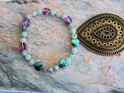 Natural Sesame Jasper/Kiwi Jasper 7mm bracelet combined with Heart Shaped Beads.  Believed to have grounding and calming properties.