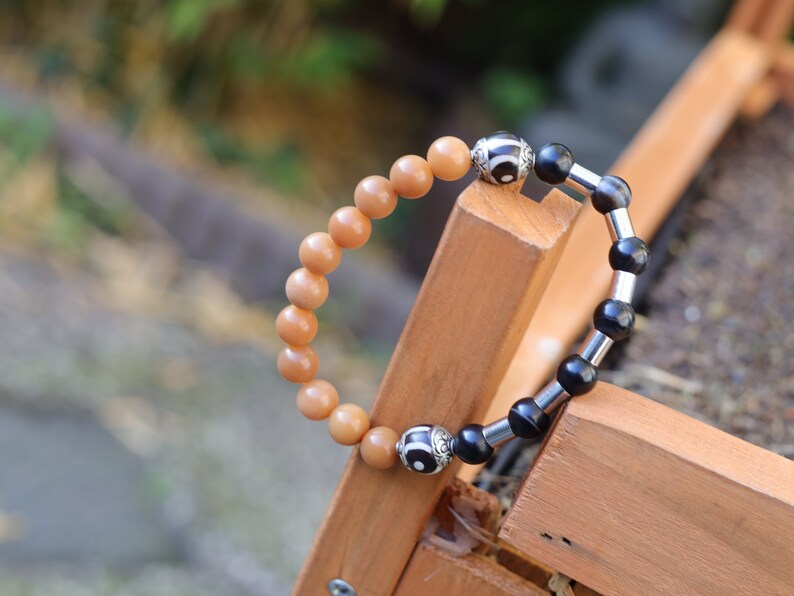 Natural Stone Striped Black Lace Agate bracelet with metal bead tube beads and Tibetan Style dZi Beads. Wajakaa, one of a kind