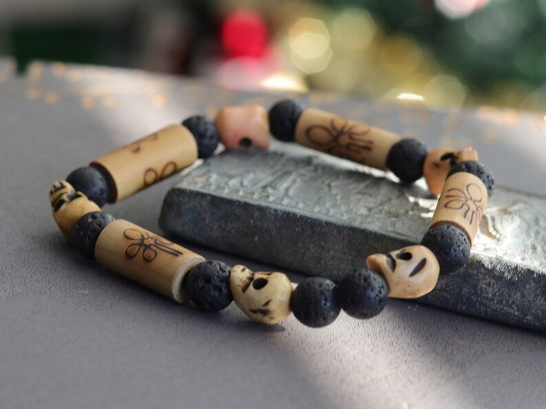Lightweight Bamboo/ Lava beaded bracelet combined with Tibetan bone SKULL beads. as a representation of death, mortality