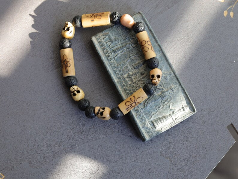 Lightweight Bamboo/ Lava beaded bracelet combined with Tibetan bone SKULL beads. as a representation of death, mortality