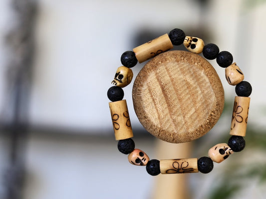 Lightweight Bamboo/ Lava beaded bracelet combined with Tibetan bone SKULL beads. as a representation of death, mortality