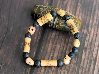 Lightweight Bamboo/ Lava beaded bracelet combined with Tibetan bone SKULL beads. as a representation of death, mortality