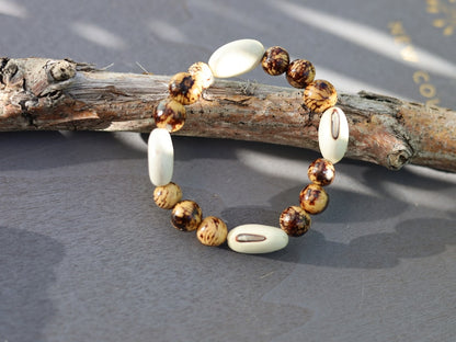 Unique Huayruro white bracelet with Acai rajado beads. Beautiful seeds, but also because they are a good luck symbol.