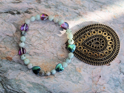 Natural Sesame Jasper/Kiwi Jasper 7mm bracelet combined with Heart Shaped Beads.  Believed to have grounding and calming properties.