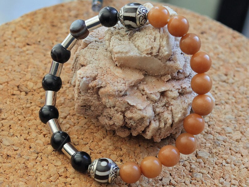 Natural Stone Striped Black Lace Agate bracelet with metal bead tube beads and Tibetan Style dZi Beads. Wajakaa, one of a kind