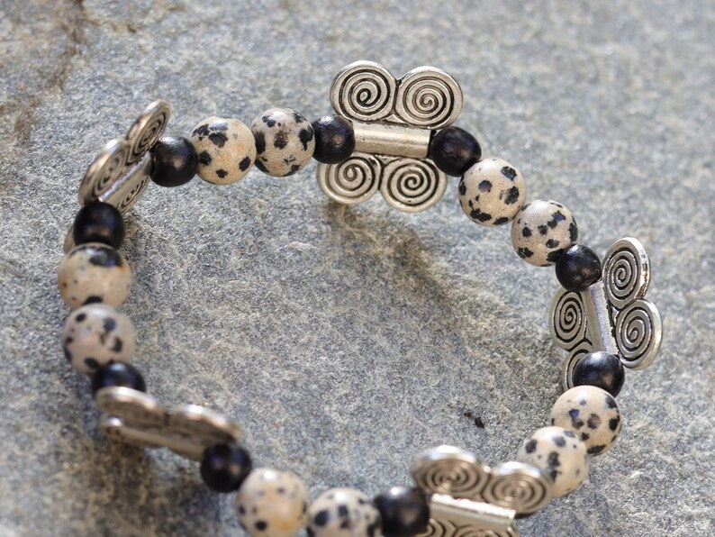 Dalmatian Jasper bracelet combined with wood and Butterfly spacers. o transform outworn thinking patterns
