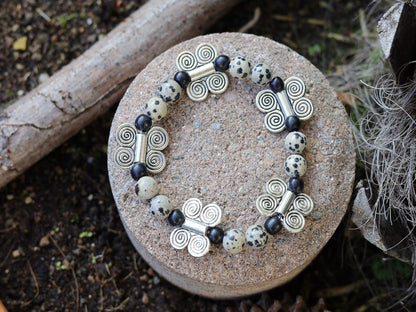 Dalmatian Jasper bracelet combined with wood and Butterfly spacers. o transform outworn thinking patterns