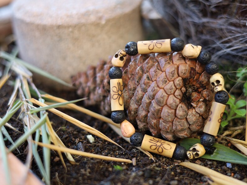 Lightweight Bamboo/ Lava beaded bracelet combined with Tibetan bone SKULL beads. as a representation of death, mortality