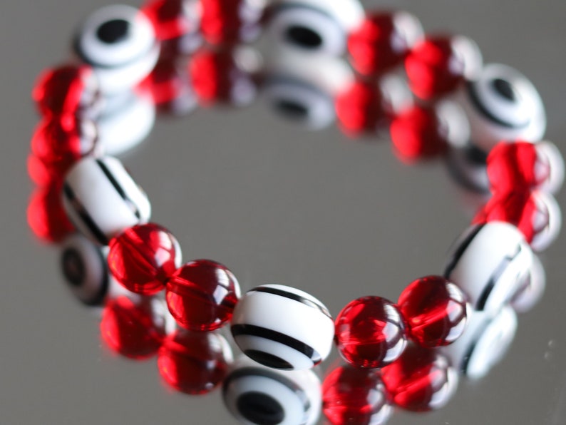 One of a kind Mexico red blood Amber beads Certified 8mm combined with black and white glass beads.