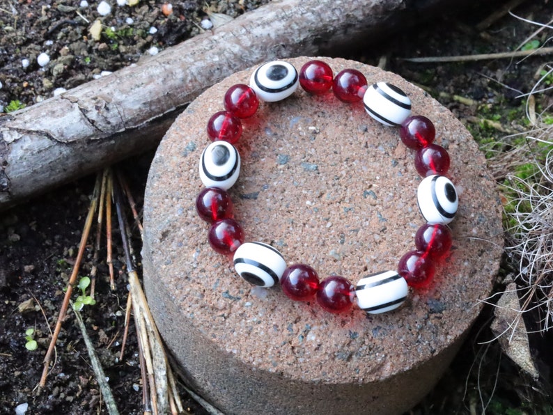 One of a kind Mexico red blood Amber beads Certified 8mm combined with black and white glass beads.