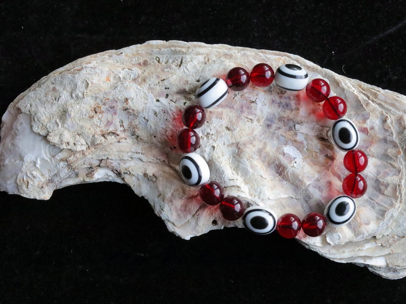 One of a kind Mexico red blood Amber beads Certified 8mm combined with black and white glass beads.